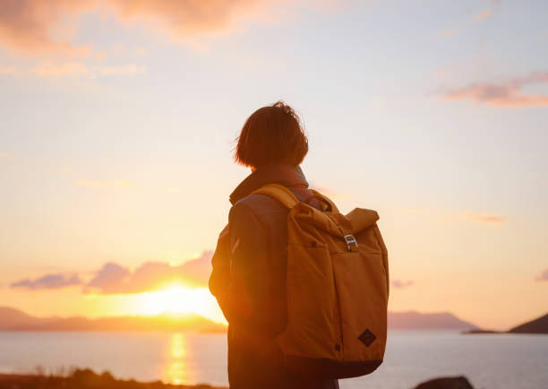 istock Woman resting alone over the sea shore, 1473528554