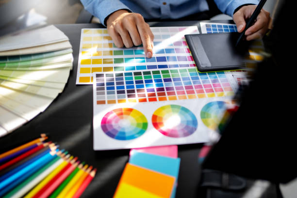 istock Creative graphic designer team working with colour swatch sample, Brainstorming ideas in studio. 1473528571