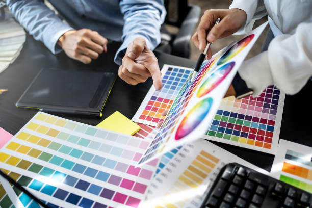 istock Creative graphic designer team working with colour swatch sample, Brainstorming ideas in studio. 1473528580