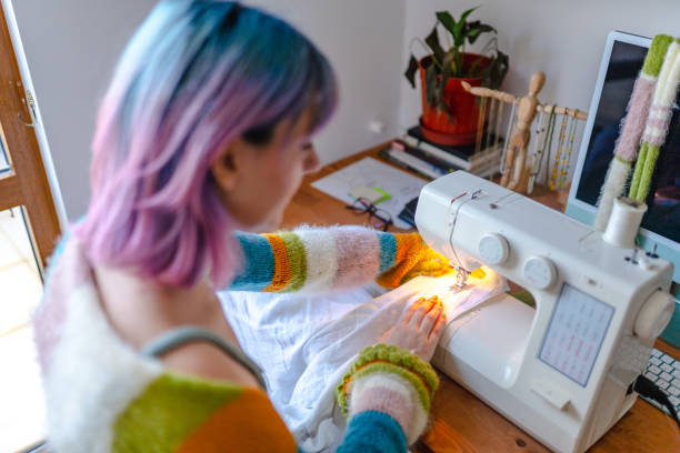 Young woman sewing her own clothes