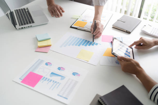 istock Startup business people teamwork calculating a valuation in workplace. 1473528665