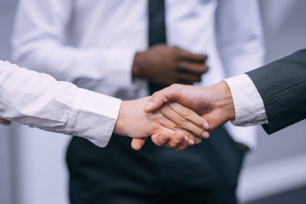 istock Business people shake hands, end the meeting. 1473530008