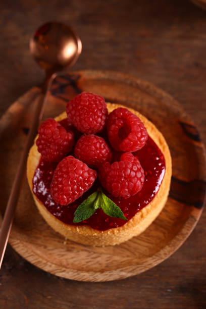 istock dessert tartlet with fresh organic raspberries 1473531467