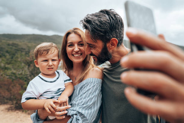istock happy bikers family take a selfie 1473533105