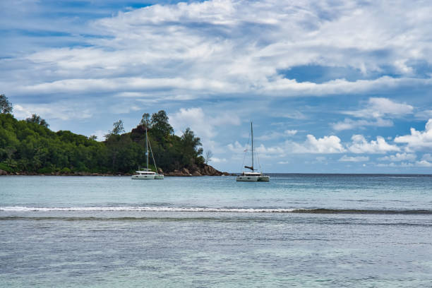 istock yachts docking at takamaka beach, Mahe Seychelles 1473534607