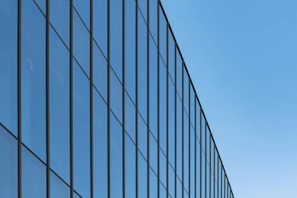 istock Exterior glass windows of a modern office building 1473535178
