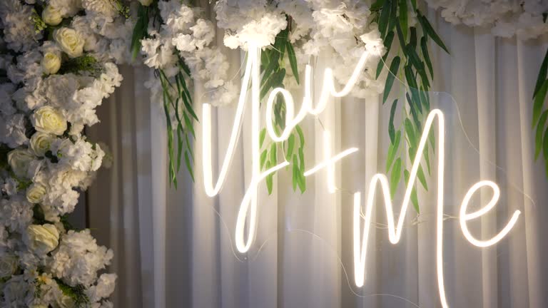 White wedding led sign, you and me, with rose flowers