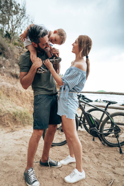 istock family on the beach with son 1473536247