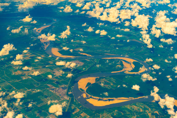 Aerial view of farms in the United States crossed by a River.