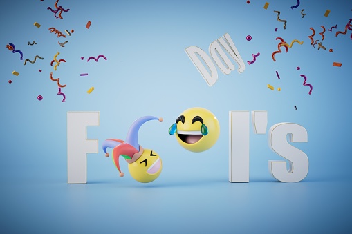 the concept of april fools' day celebrations. April Fools' Day with emoticons inside on a blue background. 3D render.