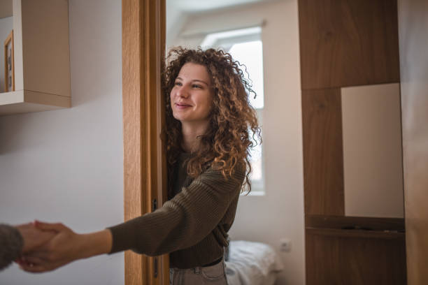istock Young woman holding hand while she is leaning against a wall 1473538105
