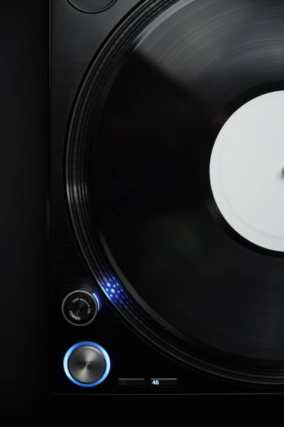 istock DJ turntable in flat lay. Professional vinyl record player shot directly from above on black background 1473540486