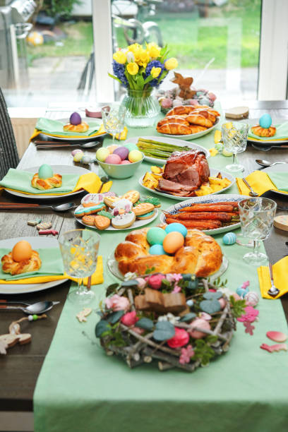 istock Easter Lunch with Roast Pork, Vegetables, Easter Cookies and Easter Cake 1473541363