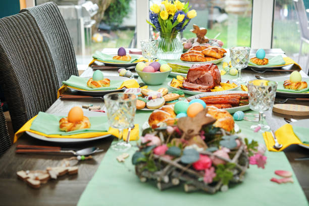 istock Easter Lunch with Roast Pork, Vegetables, Easter Cookies and Easter Cake 1473541367