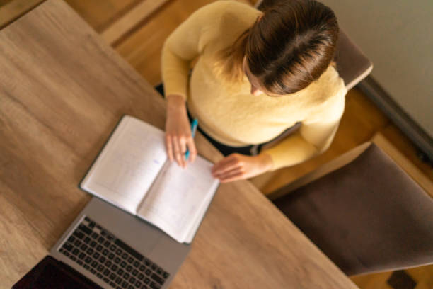 istock Top view of woman studying. 1473541963