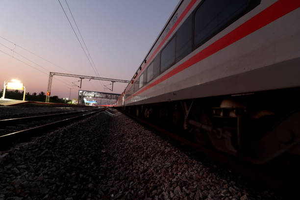 istock Train at night on railroad station 1473542552