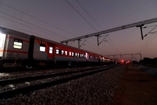 istock Train at night on railroad station 1473542555