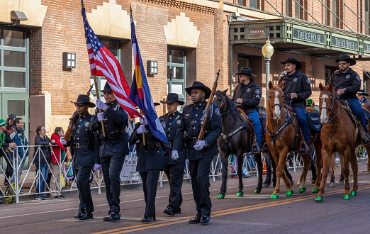 Denver, Colorado - March 11, 2023: St. Patrick's day parade in Denver, Colorado. Veterans with flags.