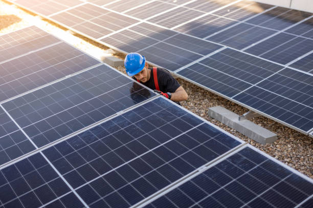 istock workers installing solar panels, for efficient energy in the city 1473545077