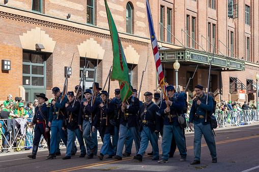 Denver, Colorado - March 11, 2023: St. Patrick's day parade in Denver, Colorado. Historic War Installation.
