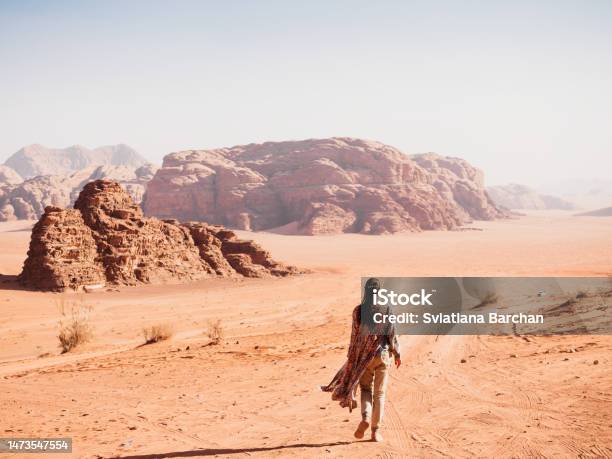 Stylish Woman And The Sights Of The Wadi Rum Stock Photo - Download Image Now - Jordan - Middle East, Aqaba, Wadi Rum