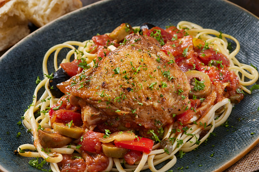 Italian Braised Chicken Thigh Cacciatore with Olives, Onions, Red Peppers, Tomatoes and Linguini