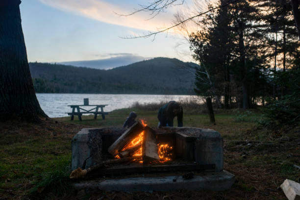 istock a mother and daughter near a campfire 1473553034