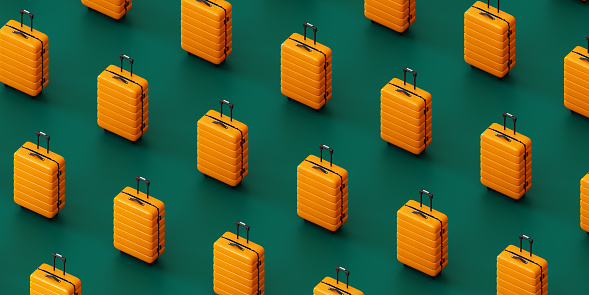3D rendering of from above of bright yellow suitcases placed in row against green background, isometric view