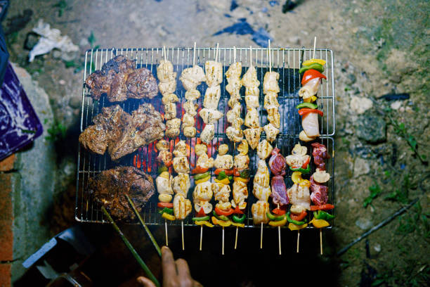 Barbecue grill in the night at camping ground. Camping and glamping in Malaysia.