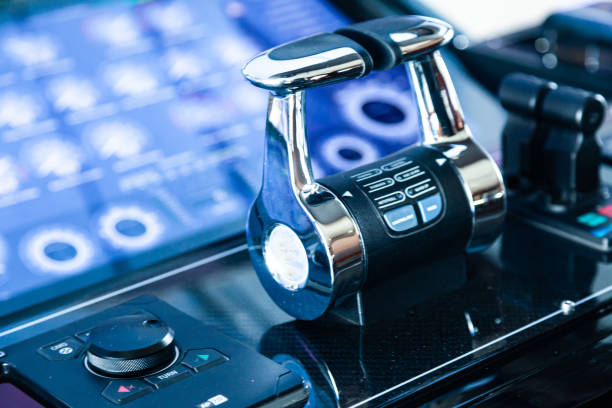 Luxury yacht cockpit with dashboard, steering wheel and acceleration levers.