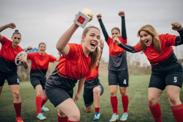 istock Female rugby team won a trophy 1473559085