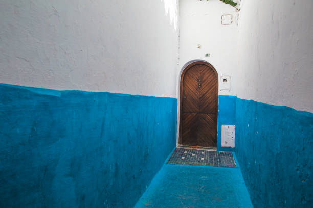 Asilah, Morocco - September 7th 2018 : View of a house in street with blue painted walls