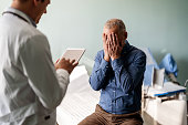 Doctor Treating Male Patient Suffering With Depression