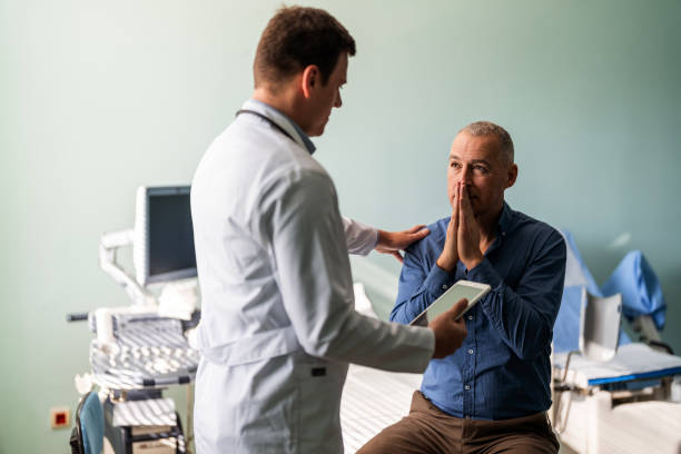 istock Distraught mature man meets with mental health professional 1473559558