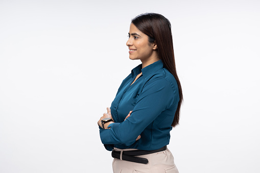 confident businesswoman posing with arms folded