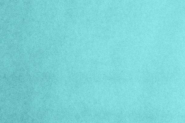 istock kraft light blue paper surface grainy texture close up 1473561519