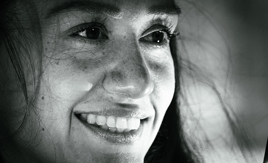 Close up of smiling woman looking away