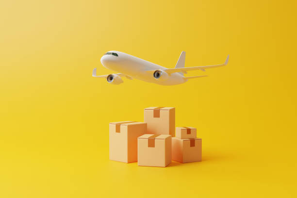 istock Group of brown cardboard boxes  under flying airplane on yellow background 1473565159
