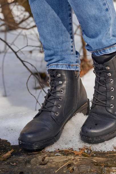 istock Woman winter boot on snow. 1473565570
