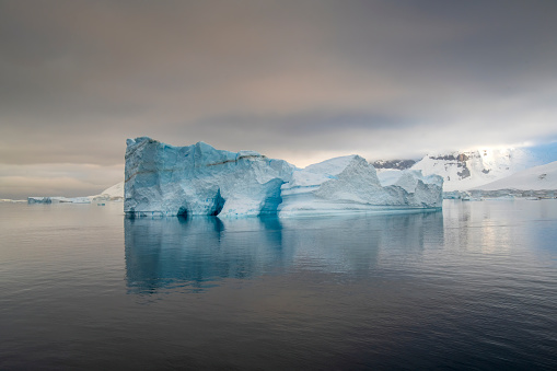 Wonderful and atmospheric landscape at Danco island with icebergs floating in Antarctica