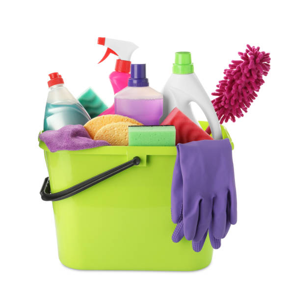 istock Green plastic bucket with cleaning supplies and tools isolated on white 1473569133