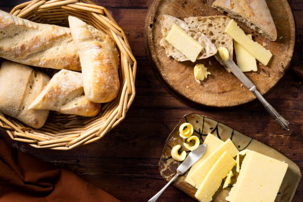 istock Bread and bread rolls in a bread basket and on a bread borad. 1473570191
