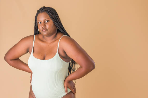 istock curvy plus size model. overweight body acceptance confidence. Latin Cuban body positive unretouched 1473571379