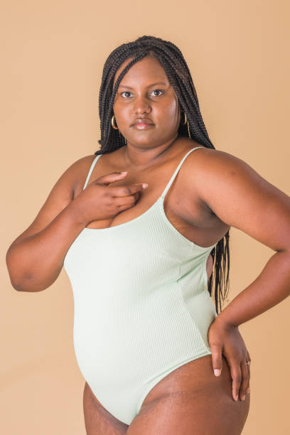 istock curvy plus size model. overweight body acceptance confidence. Latin Cuban body positive unretouched 1473571497