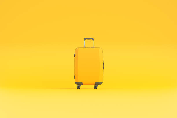 istock Travel suitcase on a yellow background with copy space 1473572626