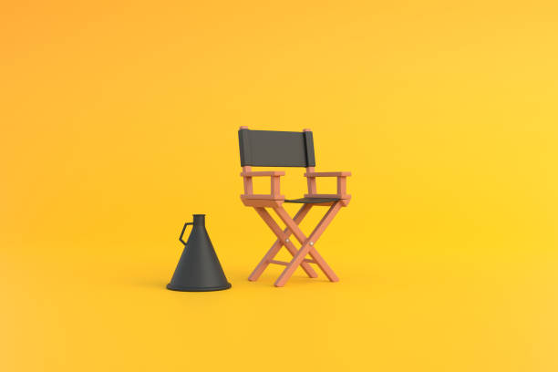 istock Director chair and megaphone on yellow background 1473572641