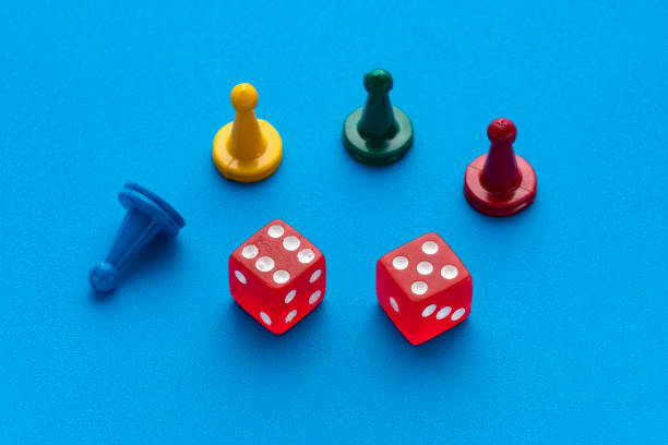 istock Colorful game chips and two dice are placed on an blue background 1473574592