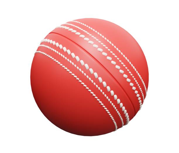 A single red leather cricket ball on bright green grass. Cricket is a popular team sport in countries such as England, Australia and India