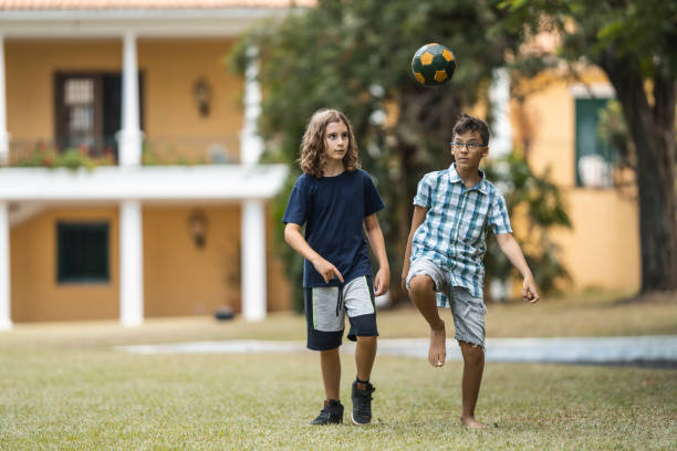 istock Children playing soccer 1473576026