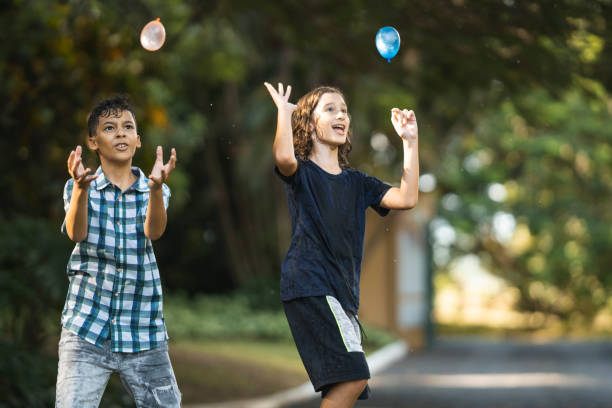 istock Children playing with water bubbles outdoors 1473576179